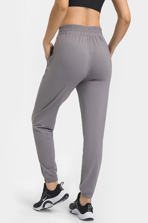 
            
                Load image into Gallery viewer, Elastic Waist Yoga Joggers with Pockets
            
        
